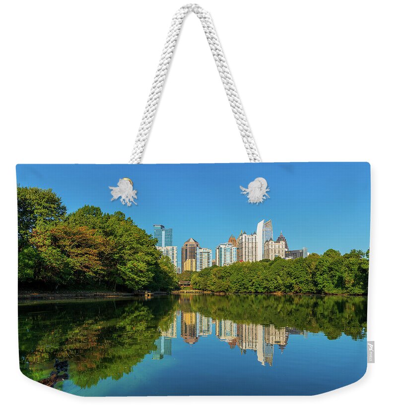 Outdoor; Travel; Georgia; South; Lake; Park; Cityscape; Pedimont; Pedimont Park; Georgia State; South East; High-rise; Reflection; Tree; Falls Weekender Tote Bag featuring the digital art Pedimont Park, Atlanta by Michael Lee