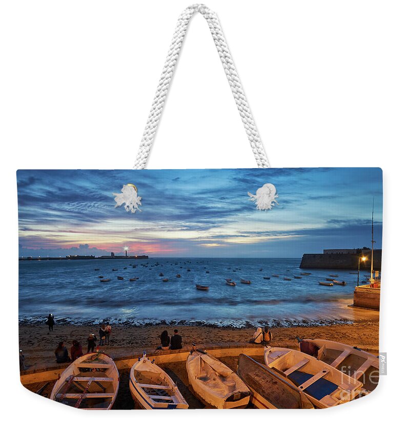 Sea Weekender Tote Bag featuring the photograph People at Caleta Beach Photographing Sunset Dramatic Sky Cadiz Andalusia Spain by Pablo Avanzini