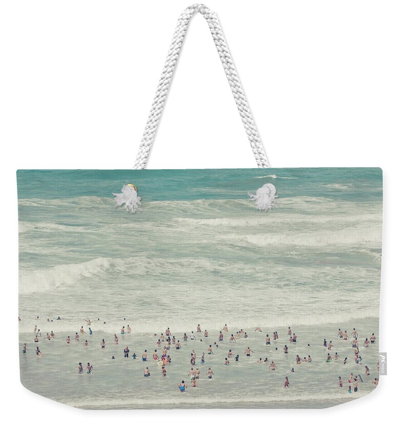 Outdoors Weekender Tote Bag featuring the photograph People Walking Into Ocean by Cindy Prins