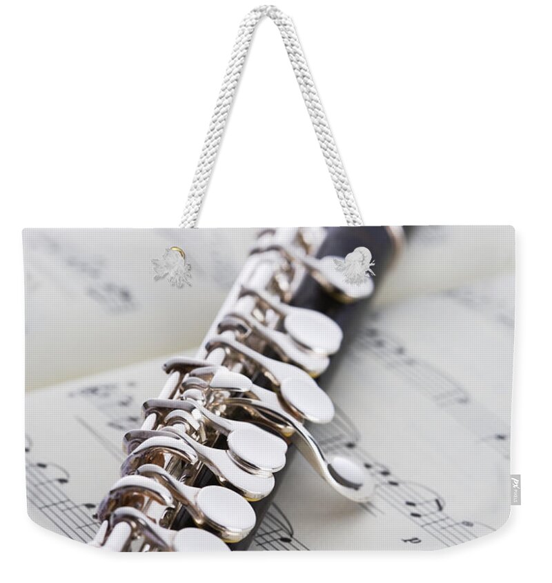 Sheet Music Weekender Tote Bag featuring the photograph Piccolo On A Score by Imagenavi