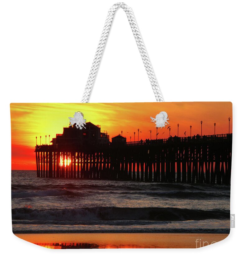 Pacific Ocean Weekender Tote Bag featuring the photograph Pier at Sunset by Terri Brewster