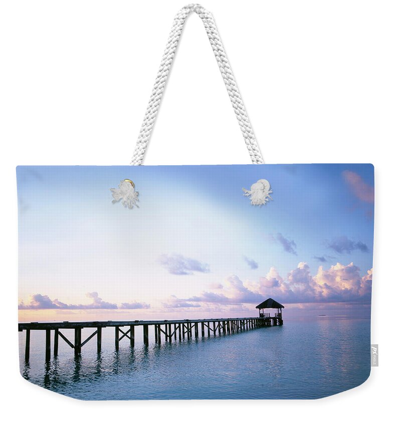 Outdoors Weekender Tote Bag featuring the photograph Pier In Indian Ocean by Buena Vista Images