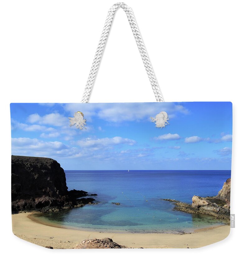 Water's Edge Weekender Tote Bag featuring the photograph Playa Papagayo In Lanzarote, Canary by Ultraforma 