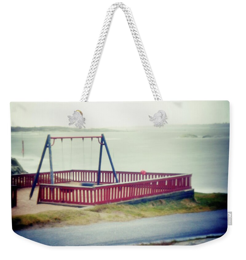 Tranquility Weekender Tote Bag featuring the photograph Playground By The Sea by Mikael Tigerström