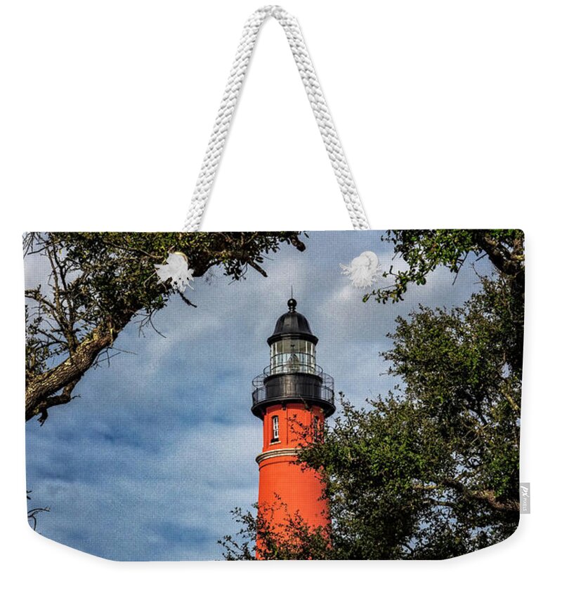 Barberville Roadside Yard Art And Produce Weekender Tote Bag featuring the photograph Ponce Inlet Lighthouse by Tom Singleton