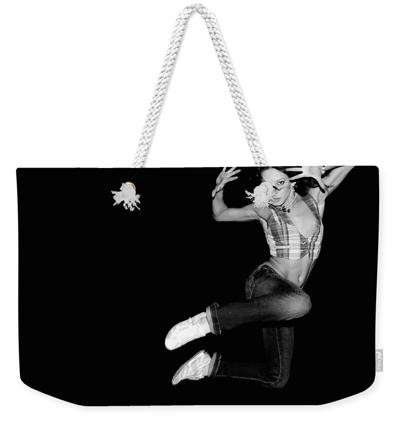 People Weekender Tote Bag featuring the photograph Portrait Of A Young Woman Jumping In by Win-initiative/neleman