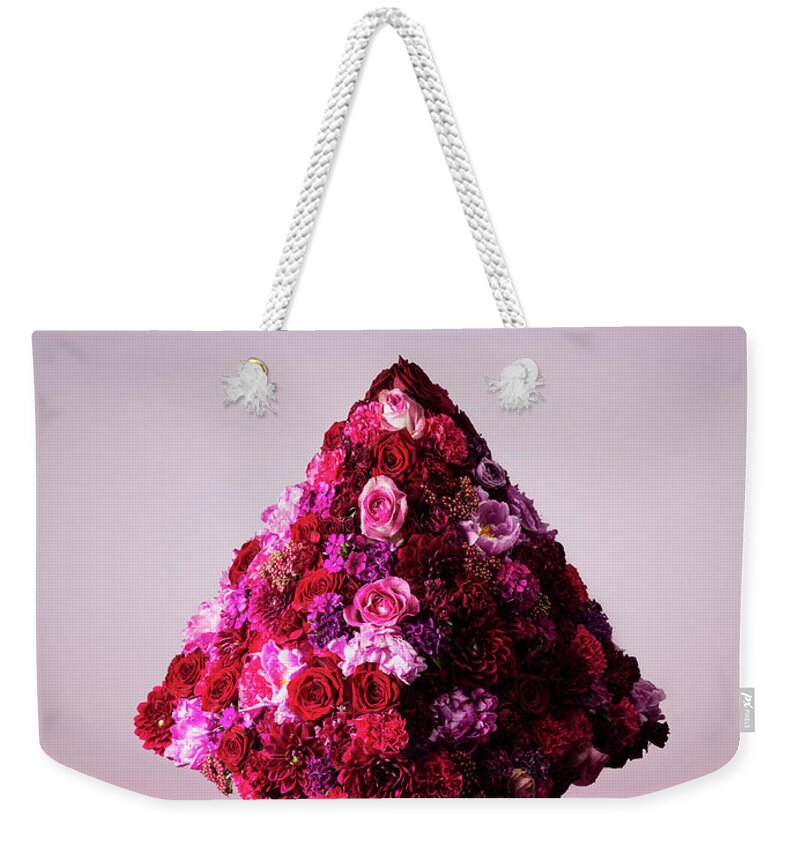 Tranquility Weekender Tote Bag featuring the photograph Pyramid Shaped Floral Arrangement by Jonathan Knowles