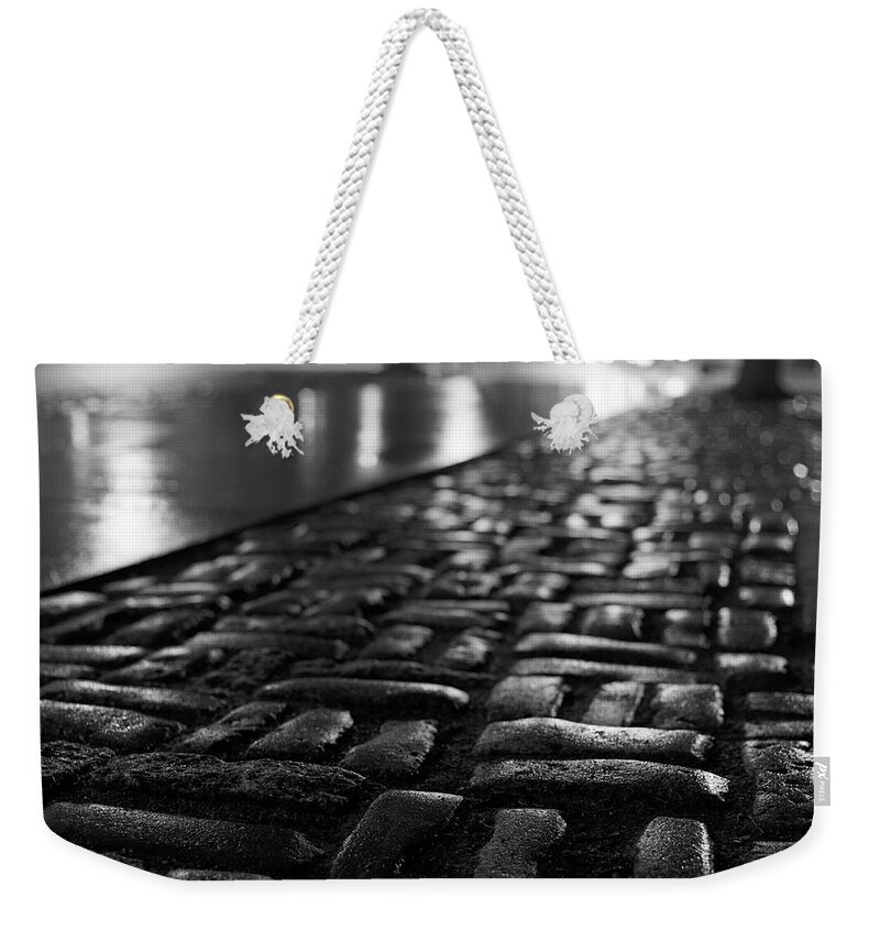 Outdoors Weekender Tote Bag featuring the photograph Rain On Cobblestones by Adam Garelick