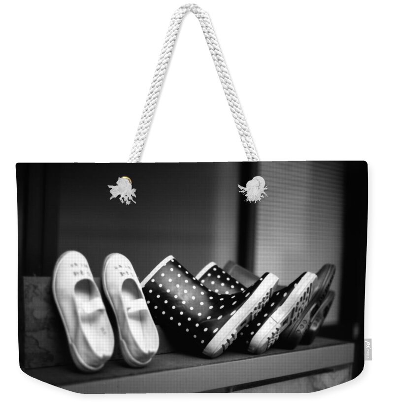 In A Row Weekender Tote Bag featuring the photograph Rain Shoes by Snap Shooter Jp