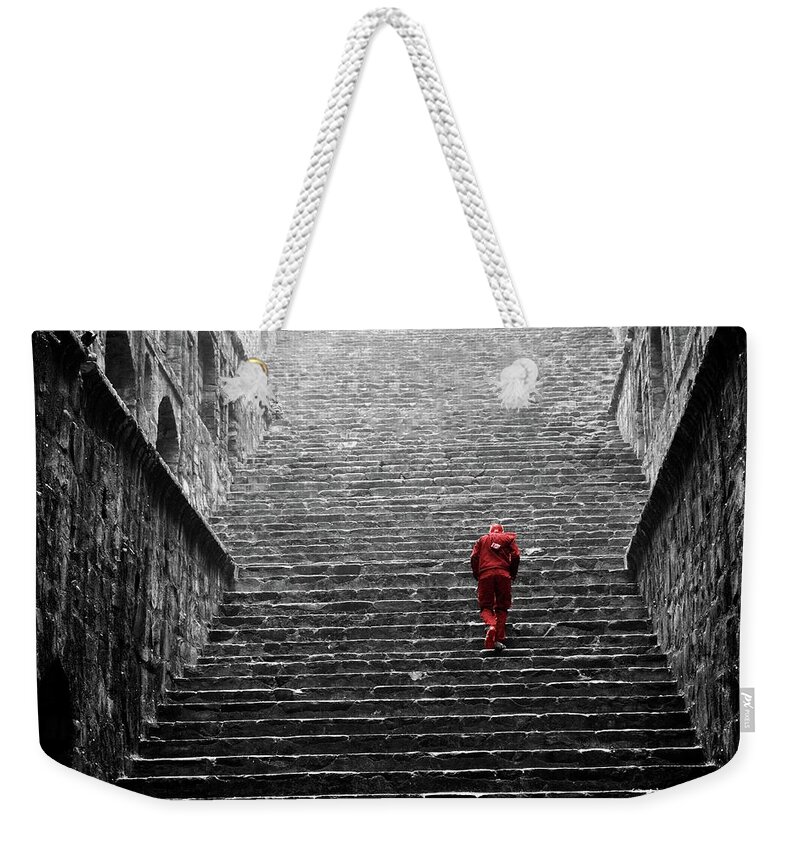 Steps Weekender Tote Bag featuring the photograph Red Man In A Baoli In Delhi by Peter Walters