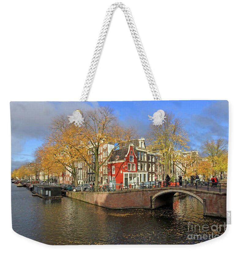 Merchant Houses Weekender Tote Bag featuring the photograph Red Merchant House by Paula Guttilla