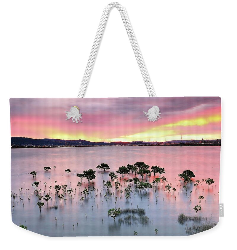 Scenics Weekender Tote Bag featuring the photograph Red Morning by Copyright Of Eason Lin Ladaga