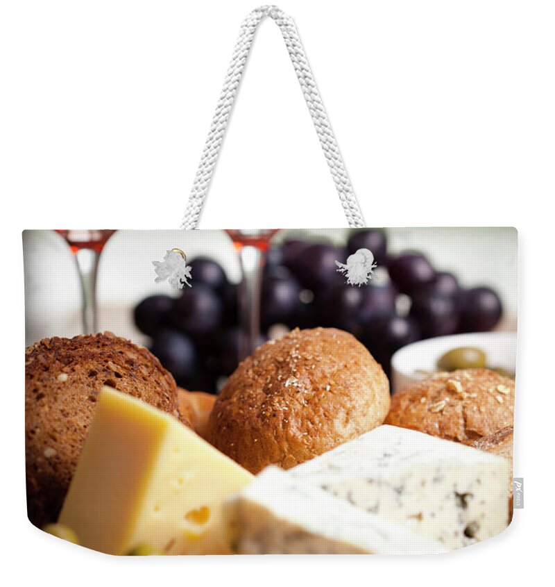 Cheese Weekender Tote Bag featuring the photograph Red Wine Whit Cheese And Olives by Jasmina007