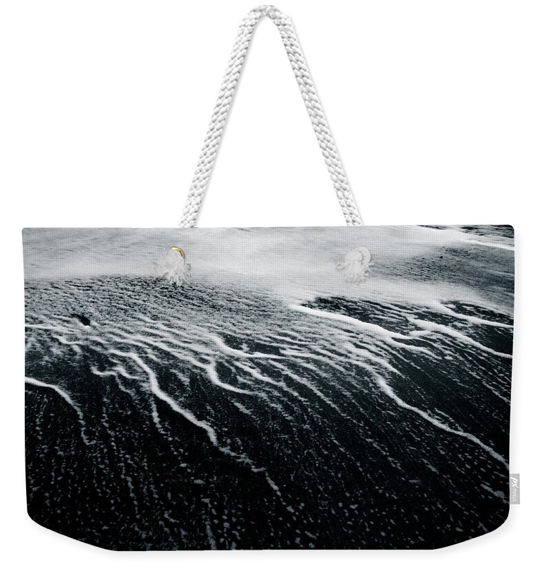 Wave Weekender Tote Bag featuring the photograph Remains Of A Wave by Dorit Fuhg