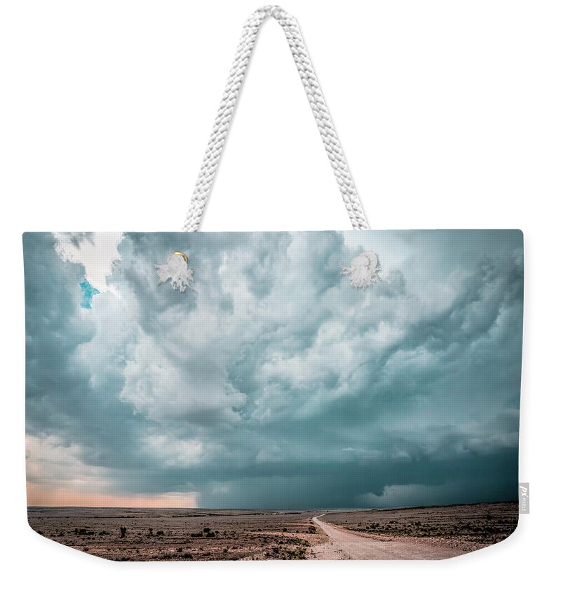Clouds Weekender Tote Bag featuring the photograph Road to Rain by Laura Hedien