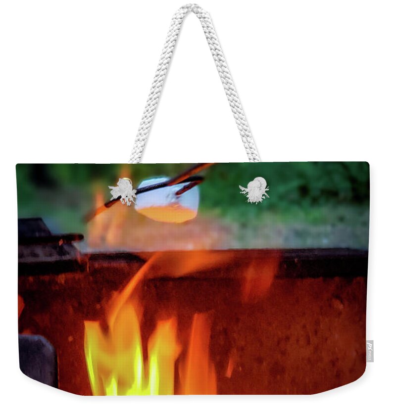 Camping Weekender Tote Bag featuring the photograph Roasting marshmallows by Thomas Nay