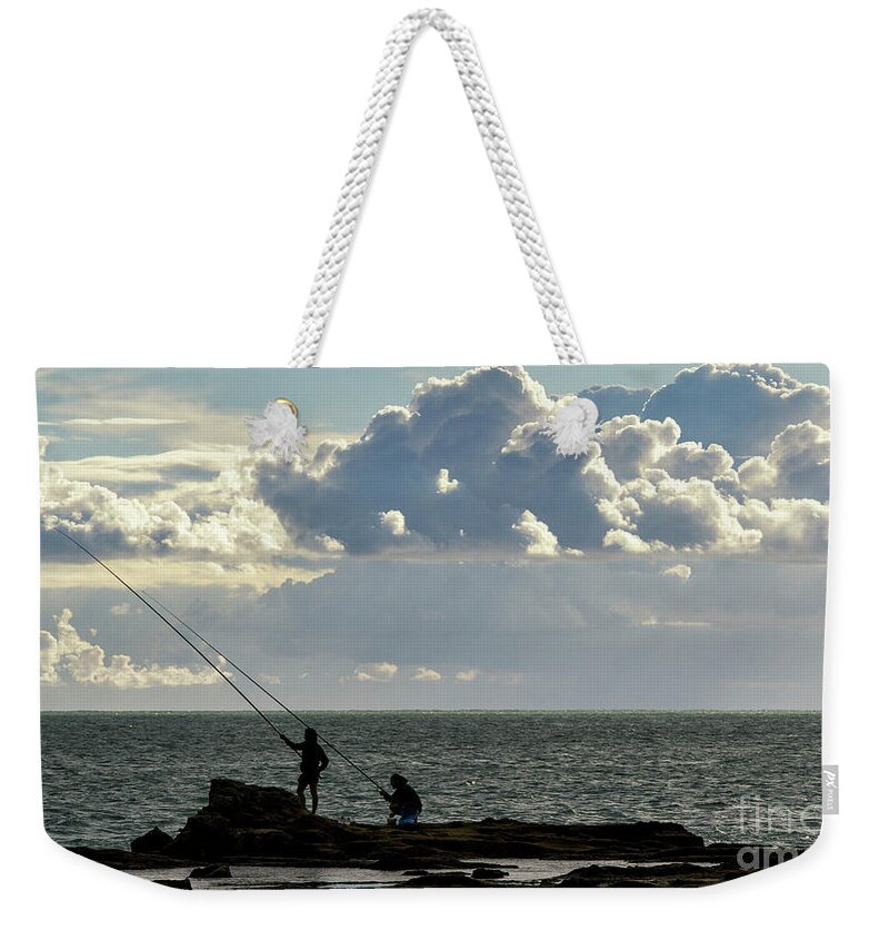 Recreation Weekender Tote Bag featuring the photograph Rock Fishing by Pablo Avanzini