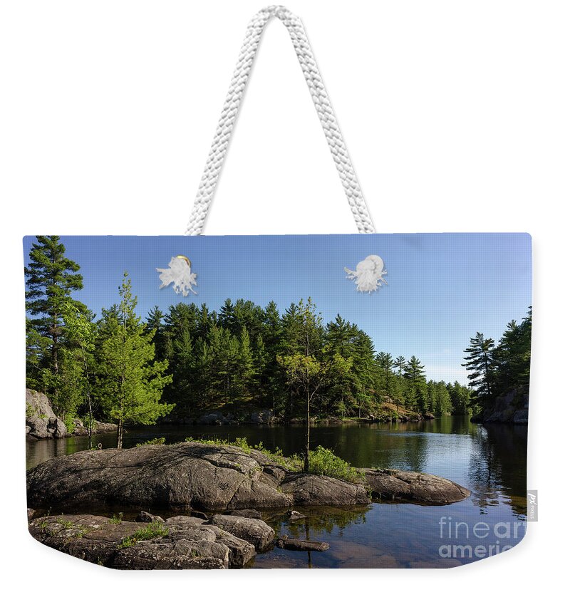 Rocks Weekender Tote Bag featuring the photograph Rocky Island On Moon River by Les Palenik
