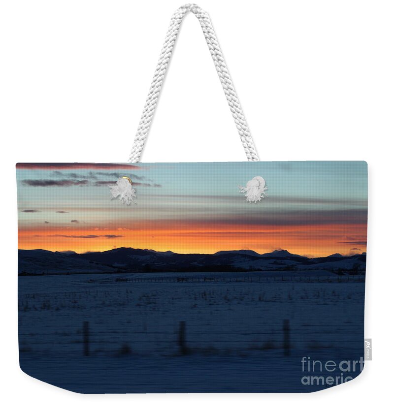 The Cowboy Trail Weekender Tote Bag featuring the photograph Rocky Mountain Sunset by Ann E Robson