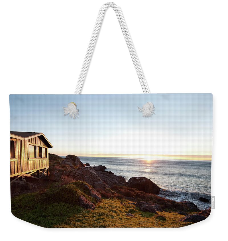 Tranquility Weekender Tote Bag featuring the photograph Rustic Wooden Cabin And Pacific Ocean by Billy Hustace