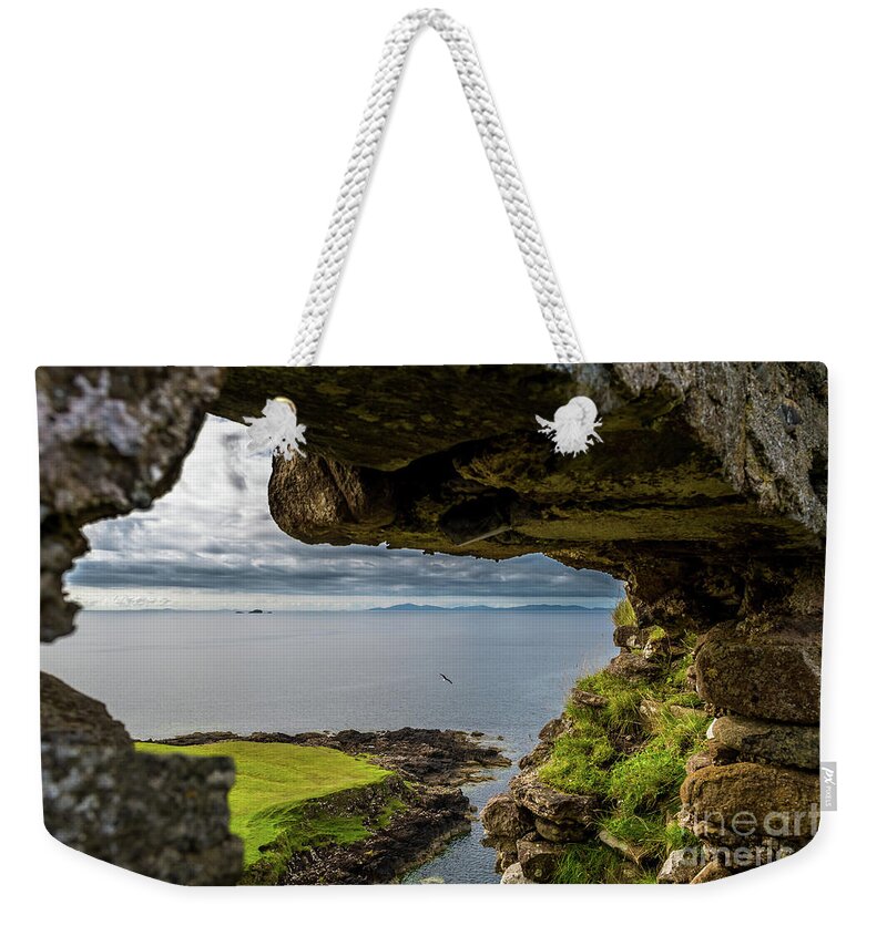 Animal Weekender Tote Bag featuring the photograph Scenic View Through Stone Window At Duntulm Castle At The Coast Of The Isle Of Skye In Scotland by Andreas Berthold