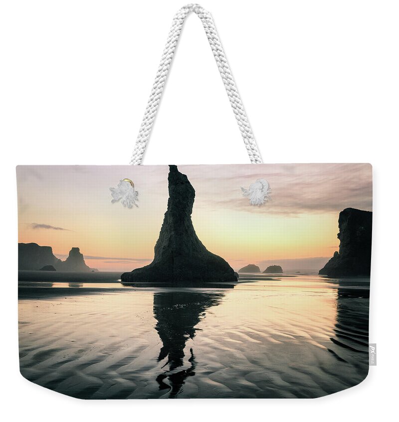Beach Weekender Tote Bag featuring the photograph Sea Stack Silhouette at Bandon Beach by Alex Mironyuk