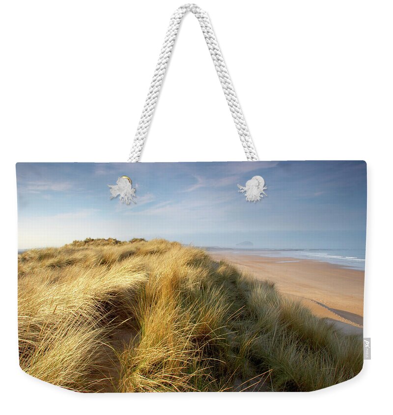 Lothian Weekender Tote Bag featuring the photograph Seabreeze On The Sand Dunes Along The by Dchadwick
