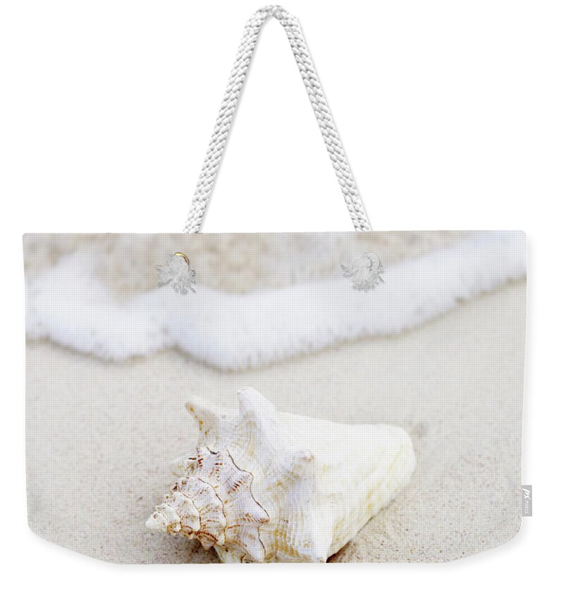 Water's Edge Weekender Tote Bag featuring the photograph Seashell At Waters Edge On Tropical by Thomas Barwick