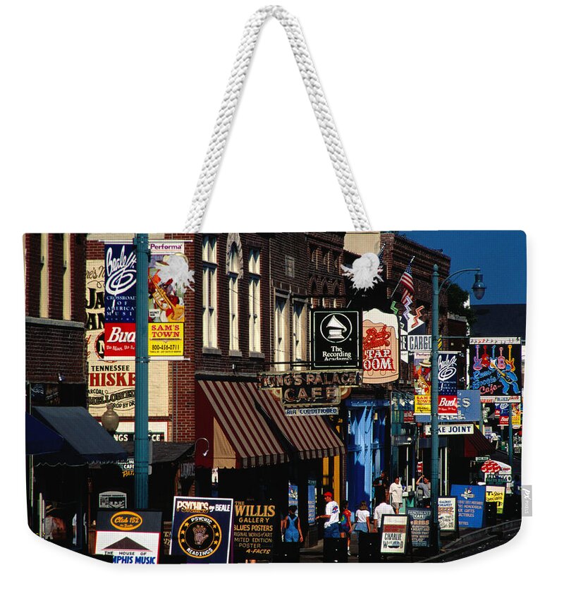 Travel14 Weekender Tote Bag featuring the photograph Shops On Beale Street, Memphis, United by Richard I'anson