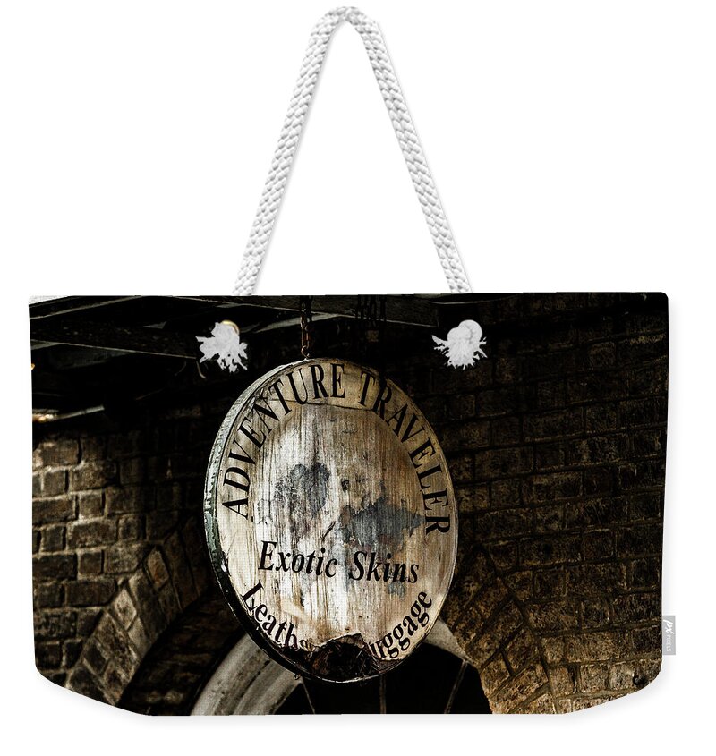Photo Weekender Tote Bag featuring the photograph Signs of the past by Jason Hughes