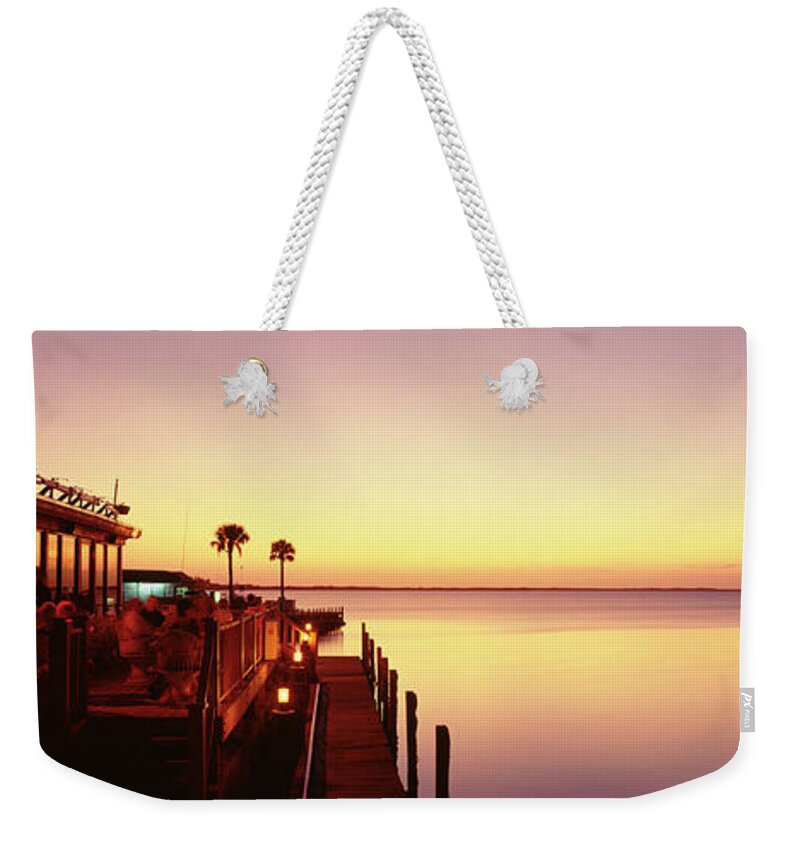 Photography Weekender Tote Bag featuring the photograph Silhouette Of A Hotel By The Sea, Key by Panoramic Images