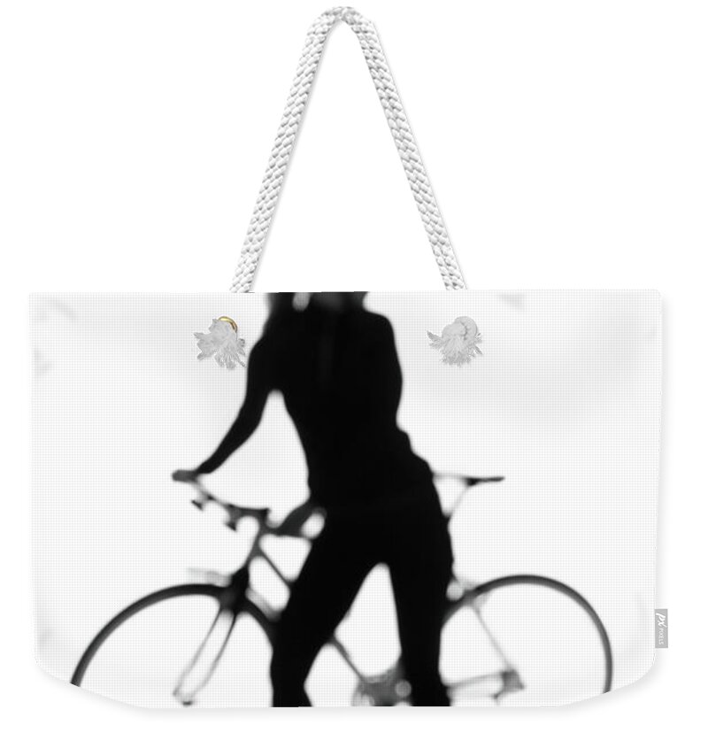 Recreational Pursuit Weekender Tote Bag featuring the photograph Silhouette Of A Woman With A Bicycle by Peter Rutherhagen