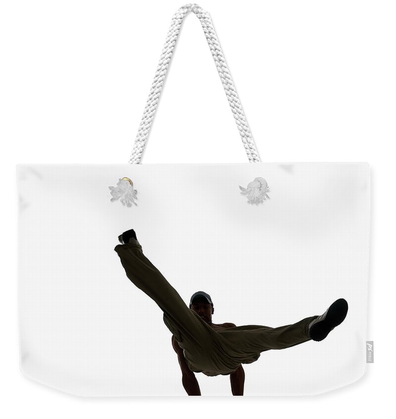 White Background Weekender Tote Bag featuring the photograph Silhouette Of Male Breakdancer by John Lamb