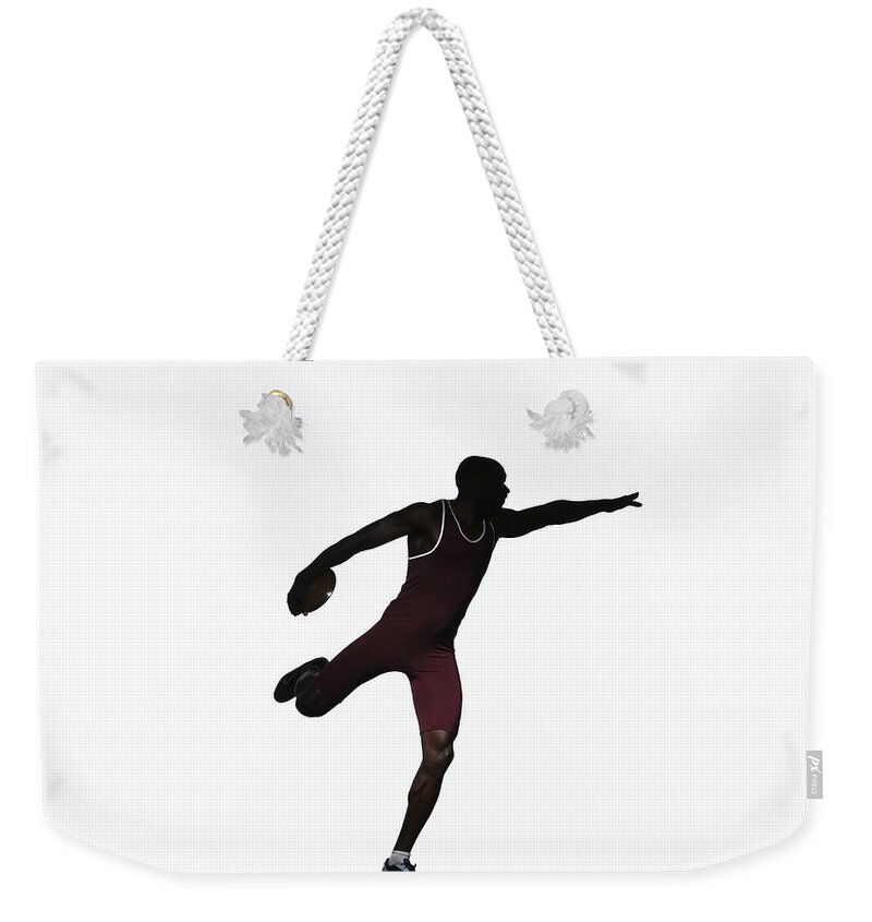 Human Arm Weekender Tote Bag featuring the photograph Silhouette Of Male Discus Thrower, Side by Paul Taylor