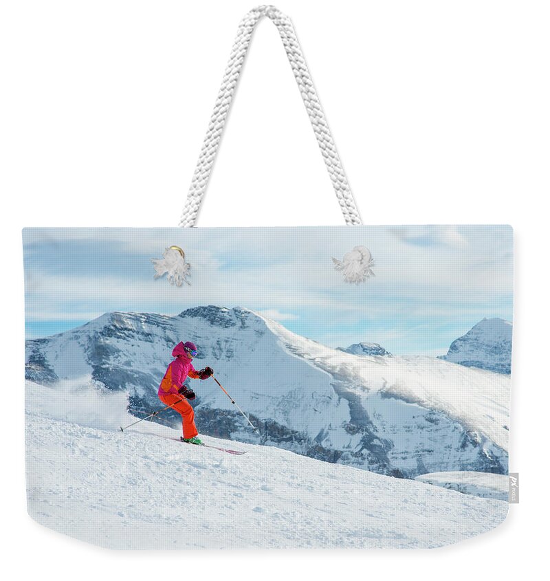 Ski Pole Weekender Tote Bag featuring the photograph Skier Descends Snowslope, Mountains by Ascent Xmedia