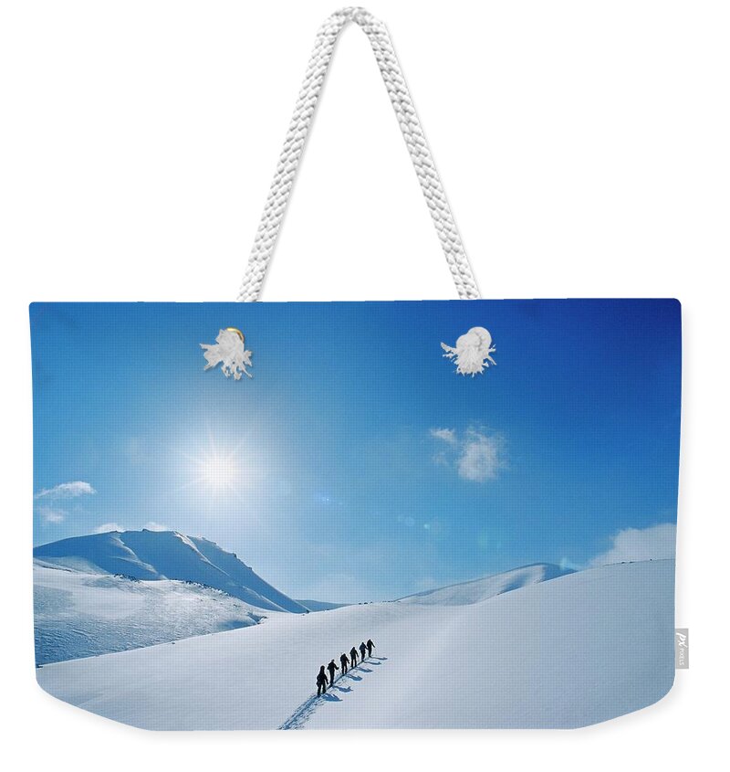 Skiing Weekender Tote Bag featuring the photograph Skiing In Norway by Lars Thulin
