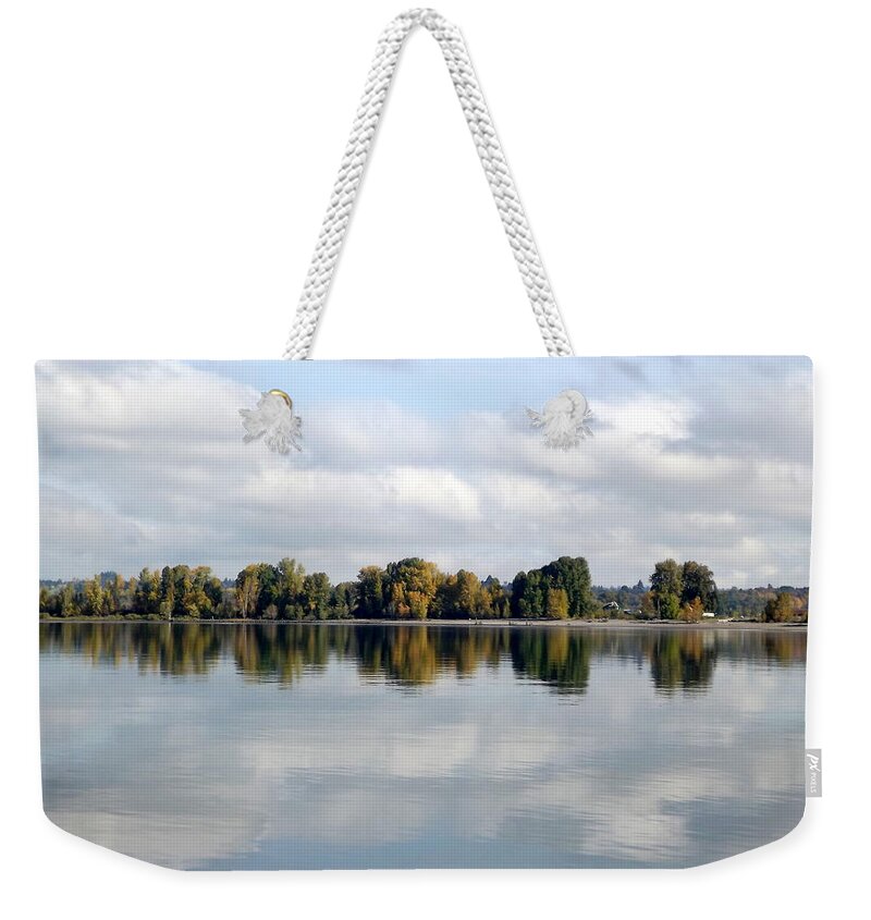 Clouds Weekender Tote Bag featuring the photograph Sky And Water by Linda Vanoudenhaegen