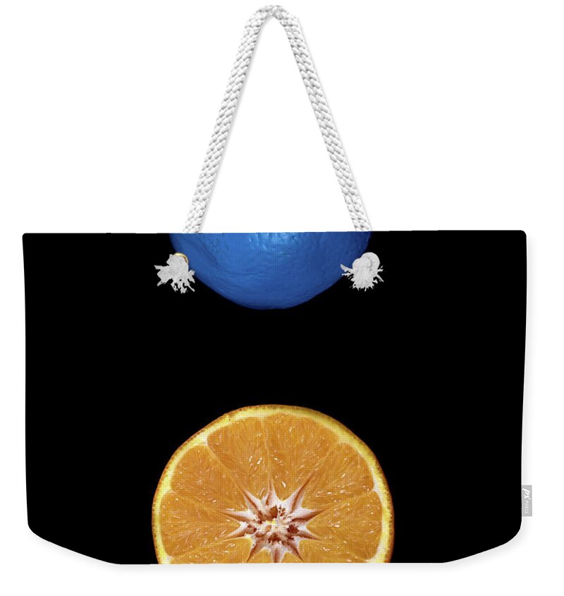 Citrus Weekender Tote Bag featuring the photograph Slices of blue and orange fresh Citrus orange fruit by Michalakis Ppalis