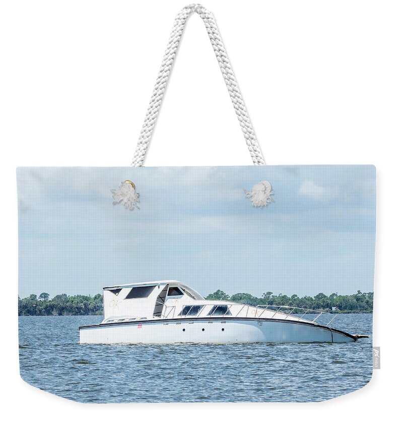 Small boat listing and in distress Weekender Tote Bag by John