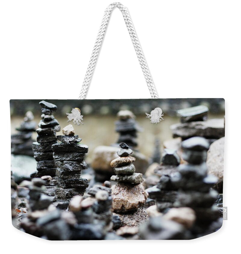 Tranquility Weekender Tote Bag featuring the photograph Small Stones by Marc-henri Desbois