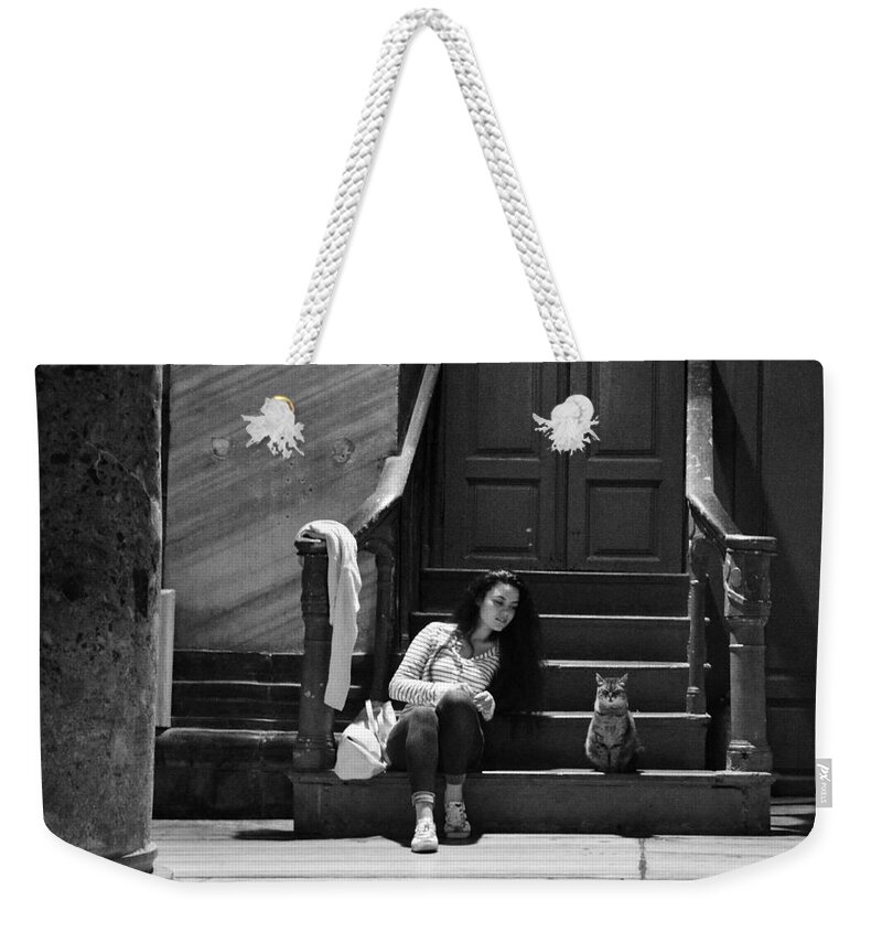 Girl And Cat Weekender Tote Bag featuring the photograph Small talk between girl and cat - Black and white by Yavor Mihaylov