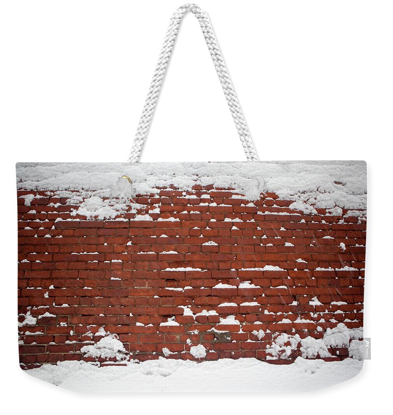 Architectural Feature Weekender Tote Bag featuring the photograph Snowy Wall by Belterz