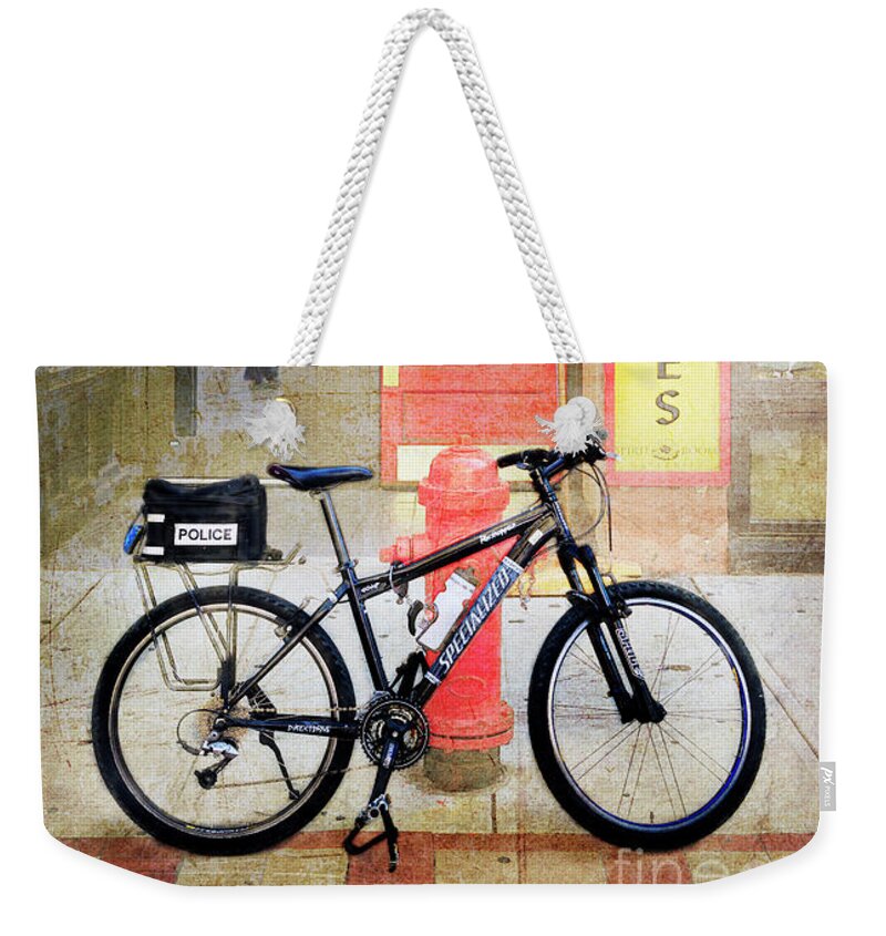 Bicycle Weekender Tote Bag featuring the photograph Specialized Police Bicycle by Craig J Satterlee