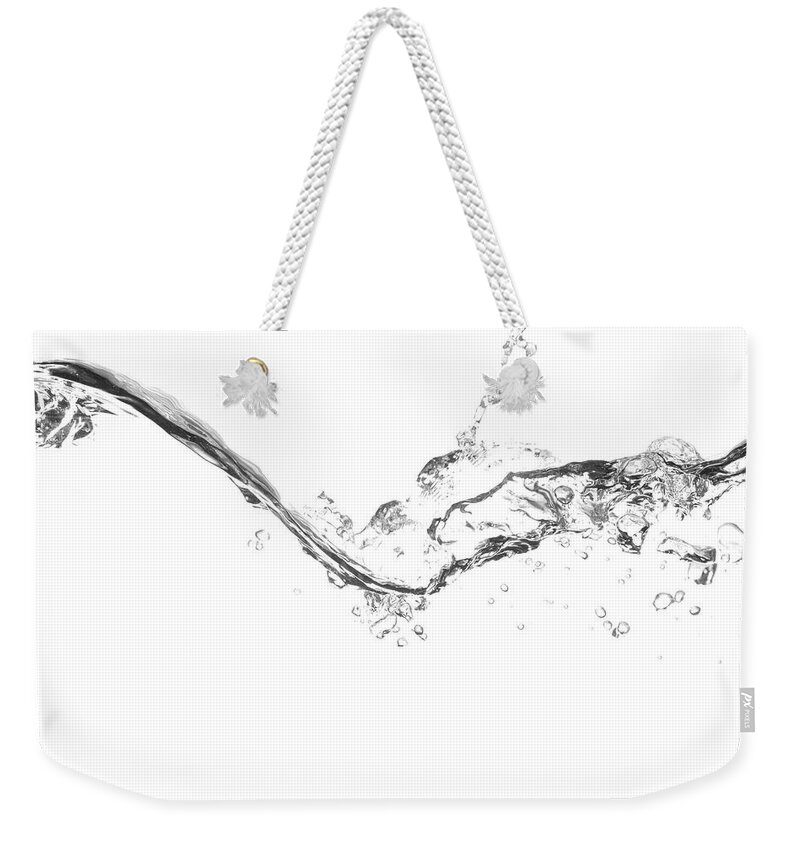 Underwater Weekender Tote Bag featuring the photograph Splash Of Water On White Background by Mkurtbas