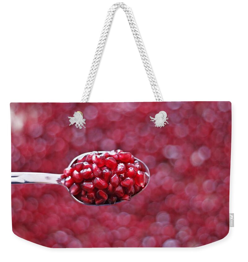 Heap Weekender Tote Bag featuring the photograph Spoon Of Pomegranate by Gulale