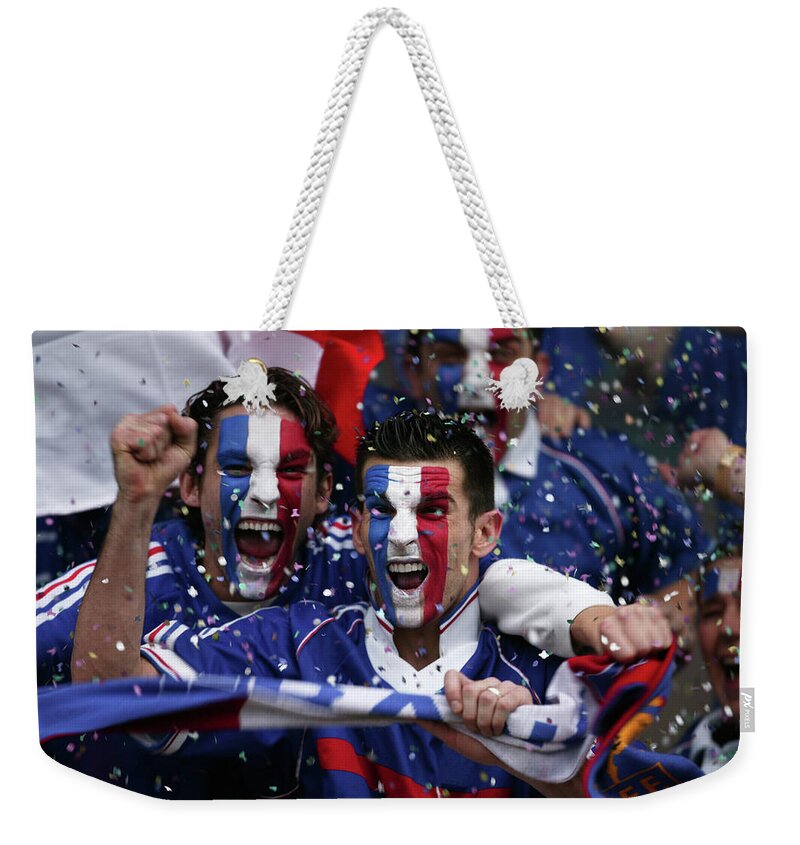 Young Men Weekender Tote Bag featuring the photograph Sports Fans With French Flags Painted by Photo And Co
