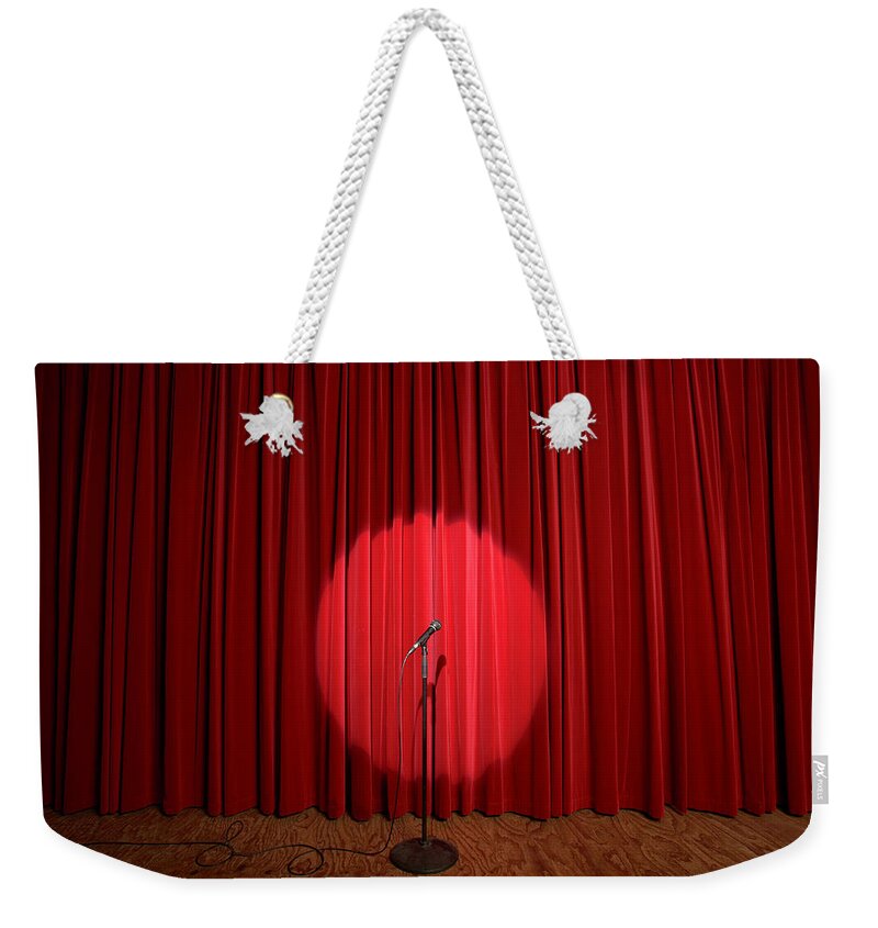 Microphone Stand Weekender Tote Bag featuring the photograph Spotlight On Microphone Stand On Stage by Adam Taylor