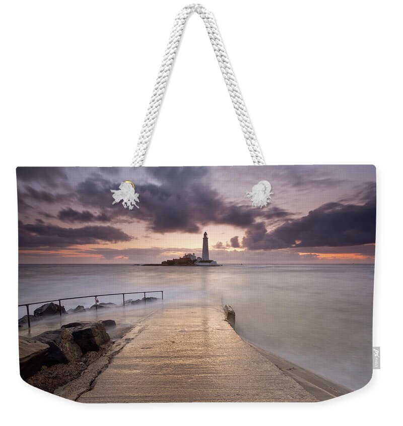 Sunrise Weekender Tote Bag featuring the photograph St Mary's Lighthouse by Anita Nicholson