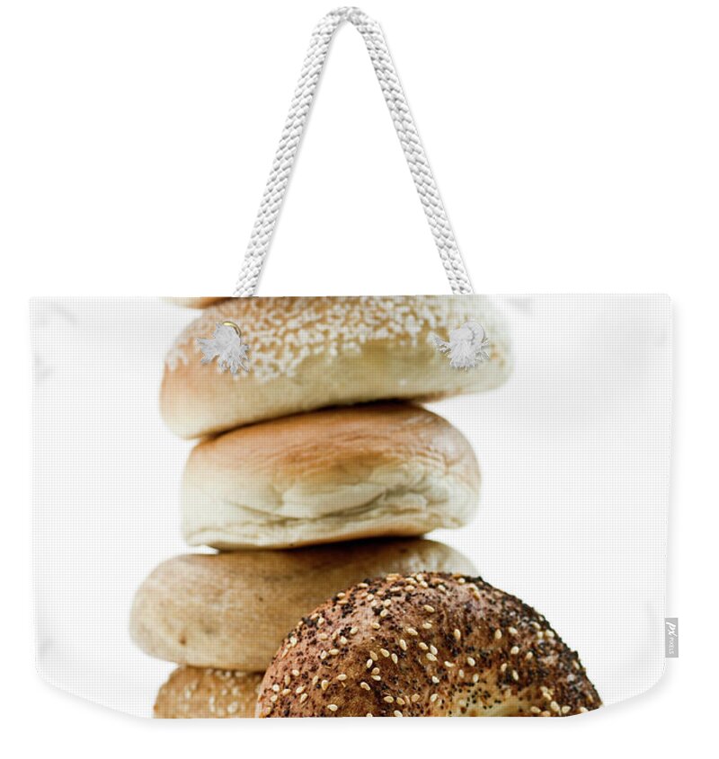 Breakfast Weekender Tote Bag featuring the photograph Stack Of Assorted Bagels by Juanmonino