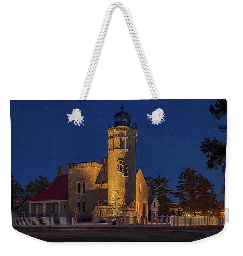 Mackinaw Weekender Tote Bag featuring the photograph Starry Night At Old Mackinac Point Lighthouse by Gary McCormick